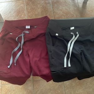 2 pairs of lightly used figs scrub pants. Black and burgundy.